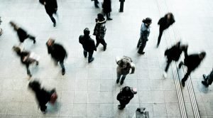 people walking on grey concrete floor during daytime