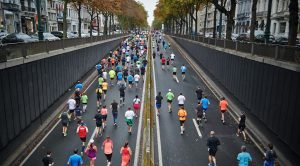 people running on road during daytime